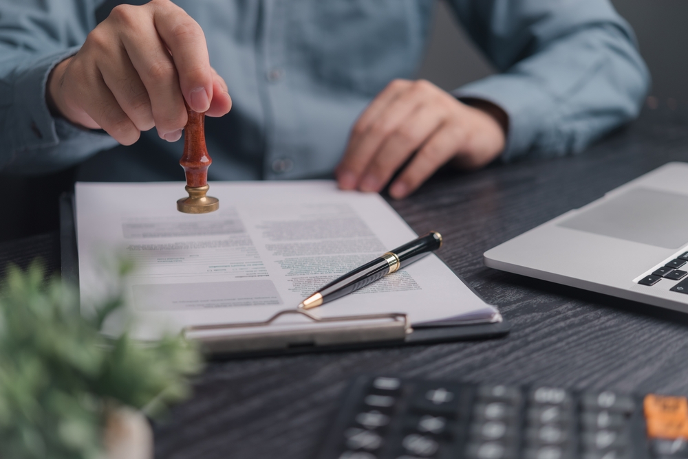 Person,Hand,Holding,Stamp,Rubber,Document,Approve,Certify,Contract,Law